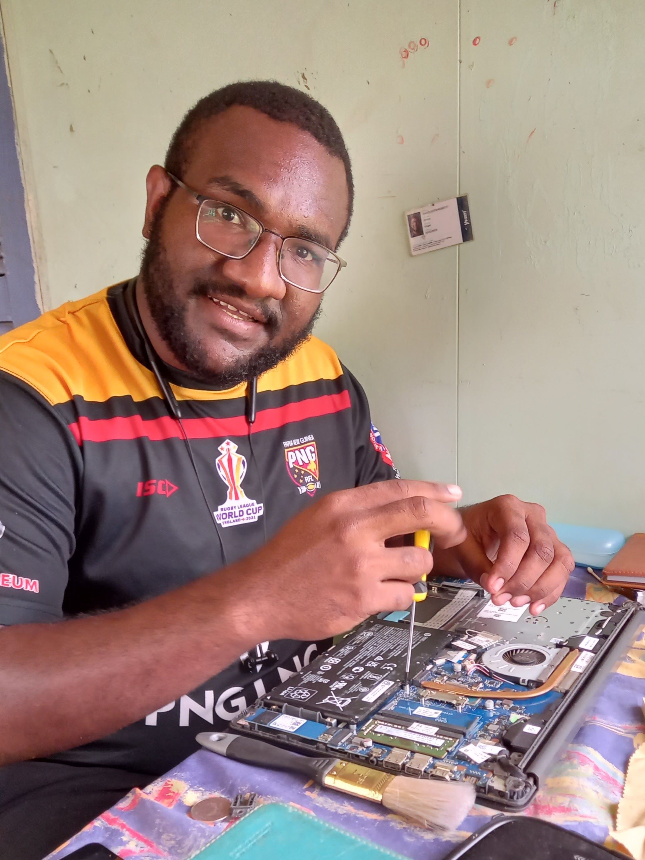 image of joshua junior kingal troubleshooting his personal computer